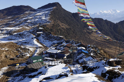 Aerial view of snowcapped mountains against sky