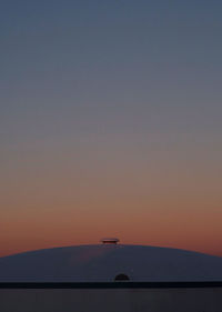 Scenic view of sea against clear sky during sunset