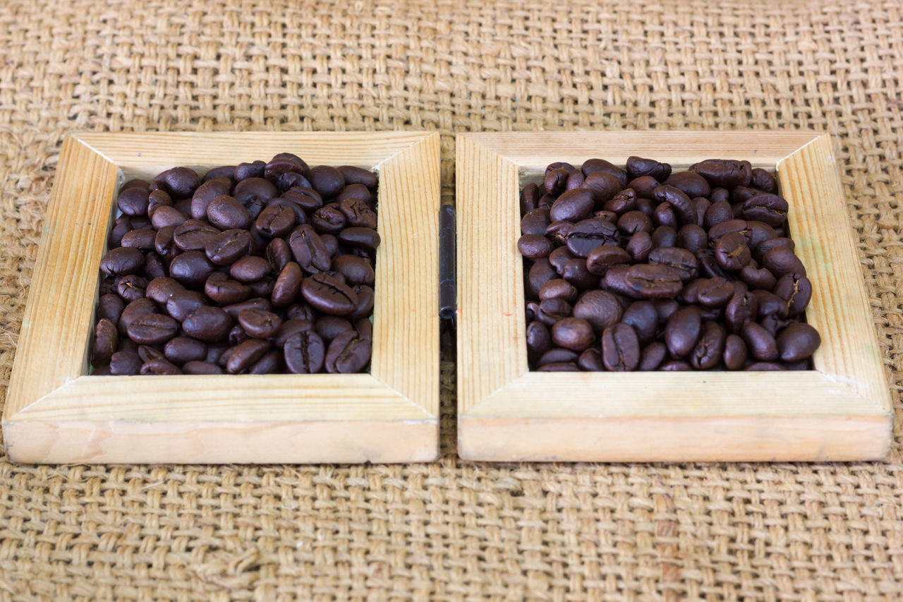 CLOSE-UP OF ROASTED COFFEE BEANS IN GLASS