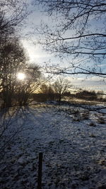 Scenic view of frozen lake against sky during winter