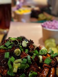 Close-up of chopped vegetables in bowl on table