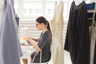 Side view of woman working