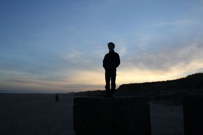 Silhouette of people at sunset