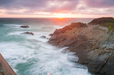 Scenic view of sea against sky during sunset