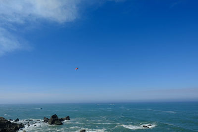 Scenic view of sea against blue sky