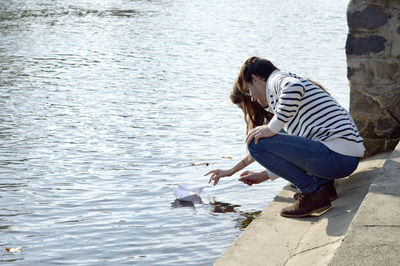 Side view of woman in lake