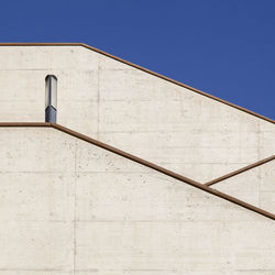 Low angle view of building against blue sky