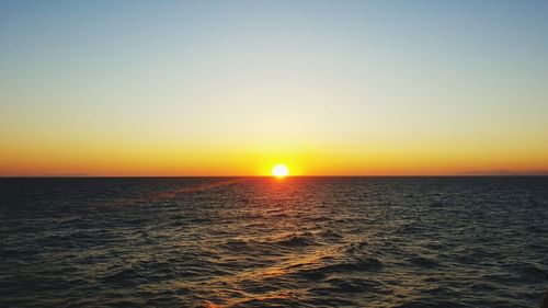 Scenic view of sea at sunset