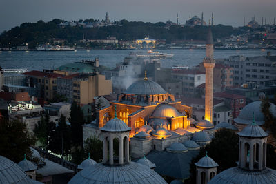 High angle view of illuminated buildings in city