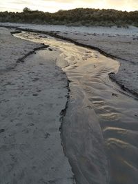 High angle view of wet sand on beach