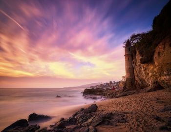 Scenic view of sea against cloudy sky