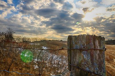 Scenic view of landscape against sky during sunset