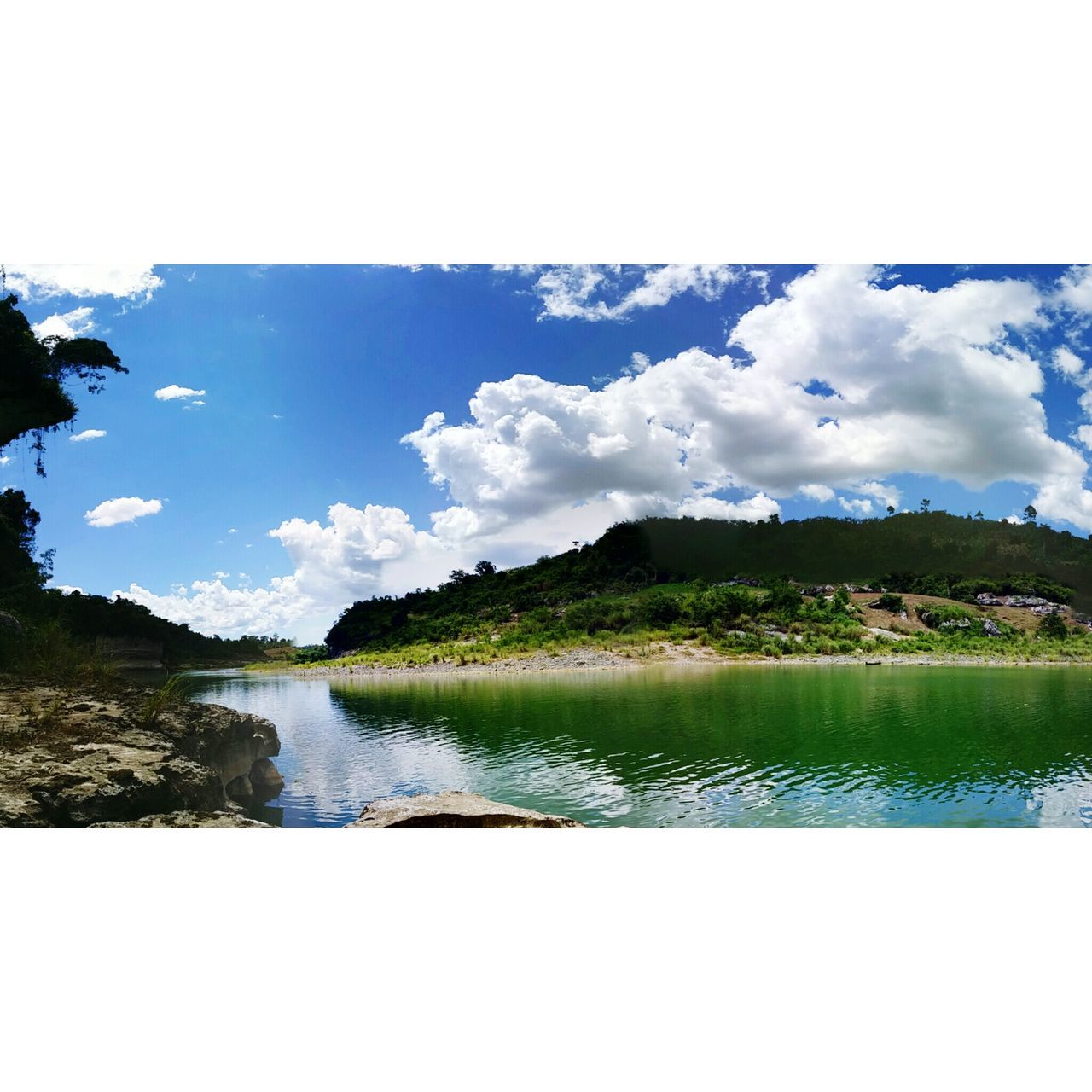 water, lake, tranquil scene, sky, tranquility, scenics, reflection, beauty in nature, transfer print, nature, blue, mountain, tree, cloud, cloud - sky, auto post production filter, river, idyllic, calm, waterfront