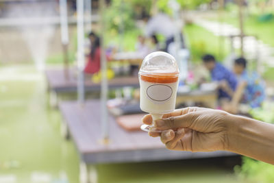 Close-up of hand holding drink