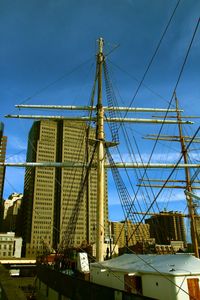 Low angle view of construction site against blue sky