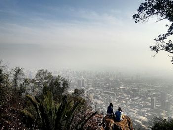 People looking at cityscape from san cristobal hill