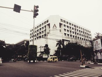 Low angle view of office building against sky