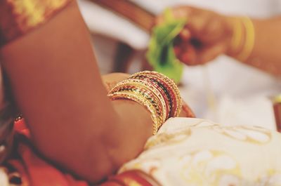 Midsection of woman sitting during wedding