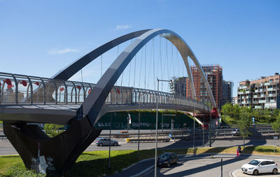 Bridge over city against sky