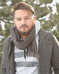 Portrait of young man standing outdoors