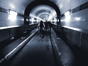 People walking in tunnel