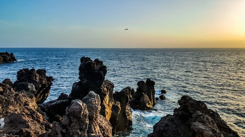 Scenic view of sea against sky during sunset