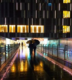 Blurred motion of woman walking in city