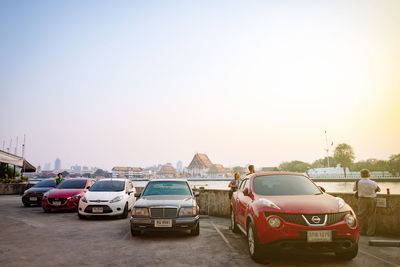 Cars on road against clear sky