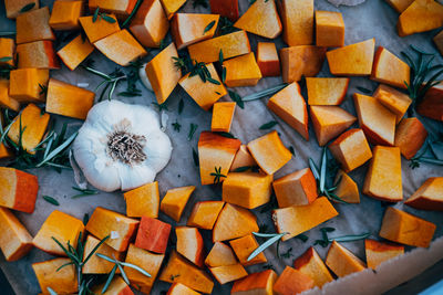 High angle view of chopped pumpkin  and garlic