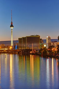 Twilight at the river spree in berlin with the famous television tower in the back