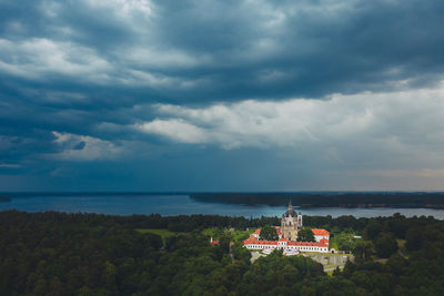 Scenic view of building against cloudy sky