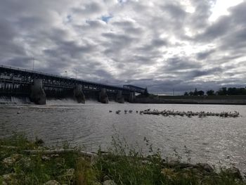 Bridge over river against sky