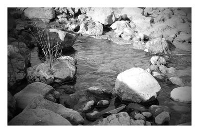 Pebbles on rock at sea shore