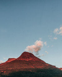 Red sunset on mountain top and summit