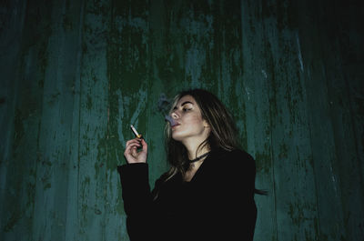 Woman smoking outdoors