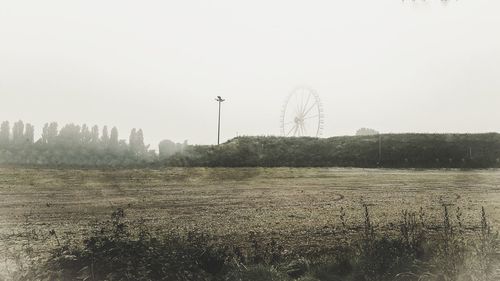 Scenic view of field against clear sky