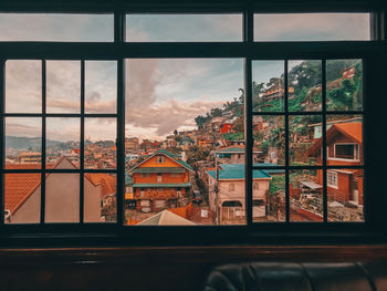 Buildings seen through glass window