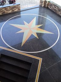 High angle view of arrow sign on road