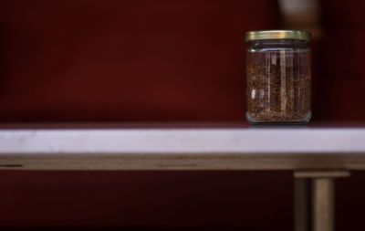 Close-up of glass jar on table