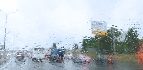 Water drops on car window during rainy season