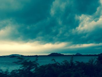 View of calm sea against cloudy sky