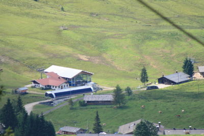 High angle view of houses on grassy field