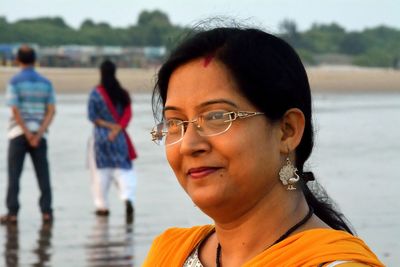 Woman looking away at beach