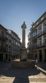 Statue of historic building against sky