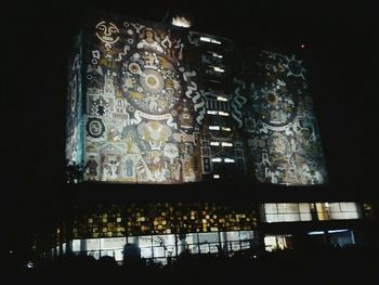 Low angle view of illuminated building at night