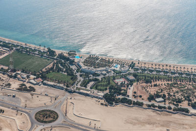 High angle view of buildings by sea