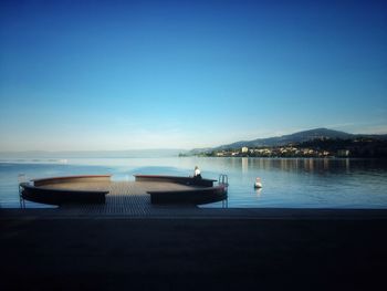 Scenic view of sea against clear blue sky