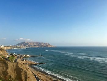 Scenic view of sea against blue sky