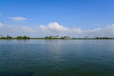 Scenic view of lake against blue sky