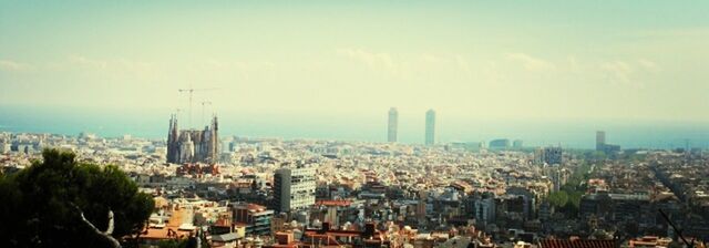 Cityscape against cloudy sky